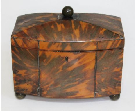 A 19th century tortoiseshell tea caddy gilt brass ball finial and feet, length 18cm.  Condition - various losses and splits t