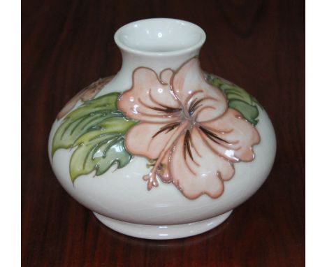 A Moorcroft pottery cream ground vase, height 10cm.  Condition - good, no chips, cracks nor any restoration, light crazing th