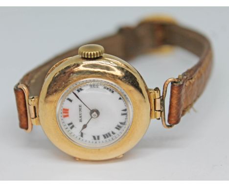 An early 20th century 15ct gold Baume &amp; Co. wristwatch having signed white enamel dial with Roman numerals and spade hand