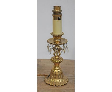 An early 20th century gilt metal table lamp with drops, height 29cm (excluding shade).  