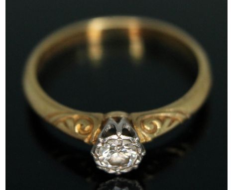 A diamond solitaire ring, the bezel set modern round brilliant diamond weighing approx. 0.20 carats, (estimated), engraved sh