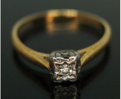 A diamond solitaire ring, marked '18ct &amp; PLAT', gross wt. 2.08g, size K.  