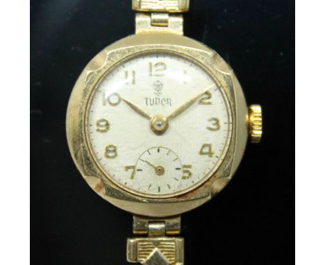 A 1960s hallmarked 9ct gold Rolex Tudor ladies wristwatch having signed champagne dial with Arabic numerals, leaf hands in go