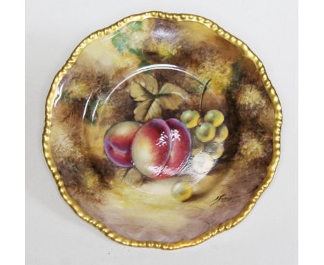 A Royal Worcester porcelain cabinet plate, hand painted with fruit and indistinctly signed, gadrooned gilt border, diam. 17cm