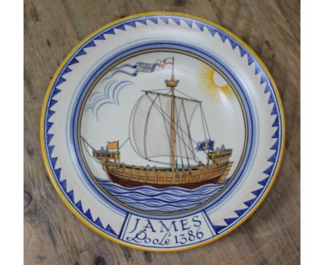 A 1930s Poole Pottery red bodied dish with ship decoration depicting a ship and entitled "James Poole 1386" designed by Arthu