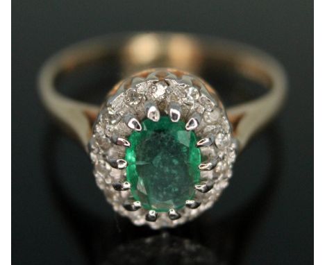 A hallmarked 9ct gold emerald and diamond cluster ring, the cluster measuring approx. 11mm x 10mm, gross wt. 2.68g, size N.  