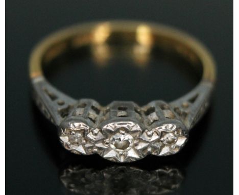 A three stone diamond ring, marked 'PLAT 18ct', gross wt. 2.08g, size K.  Condition - good, general wear only.