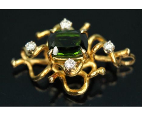 An 18ct gold diamond and tourmaline pendant of random wire form, the central rectangular cut green tourmaline weighing approx