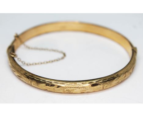 A hallmarked 9ct gold bangle, diam. 58mm, wt. 8.52g.  Condition - good, no damage/repair, general wear only.