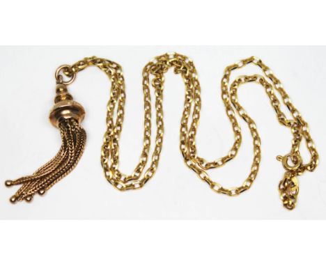 A yellow metal tassel fob, unmarked, on 48cm chain with 9ct gold import marks, gross wt. 9.03g.  Condition - fob with light d
