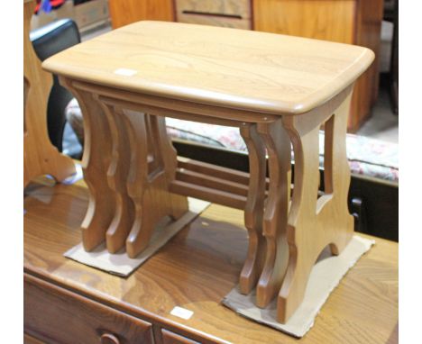 An Ercol blonde nest of tables.  Condition - good, general wear only.