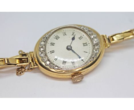 An early 20th century 18ct gold and diamond ladies wristwatch, the unsigned dial having Roman numerals and spade hands in an 