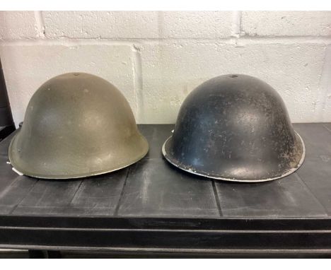 1950's British military MK III steel helmet with black camouflage finish, with liner and chin strap, together with another si
