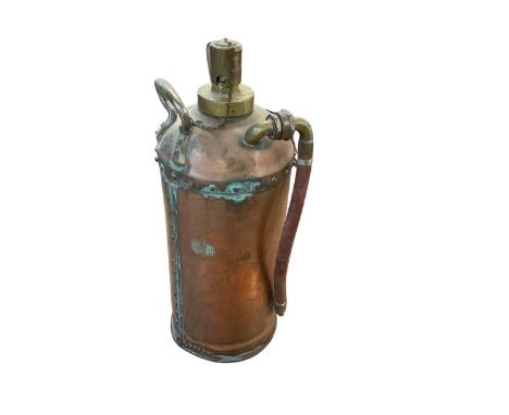 Vintage copper fire extinguisher stamped 23502 near base, approximately 50cm in height.