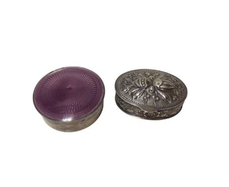 Mappin &amp; Webb silver and purple enamel round pill box (Birmingham, 1910), 4.5cm diameter, and a continental embossed silv