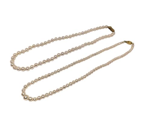 Two cultured pearl necklaces, one with an 18ct gold oval barrel clasp, 42.5cm long and the other with a 9ct gold bow clasp, 4