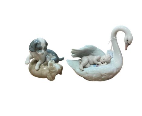 Lladro porcelain ornament of a Swan carrying a sleeping child, Nao ornament of two dogs, and other figures including Royal Wo