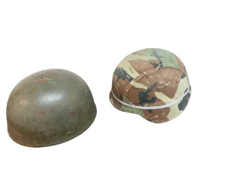 1950's British Military Despatch Riders' helmet together with an American helmet with camouflage cover (2).