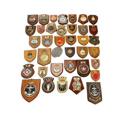 Collection of various military related crests to include army and navy associations (approximately 33)