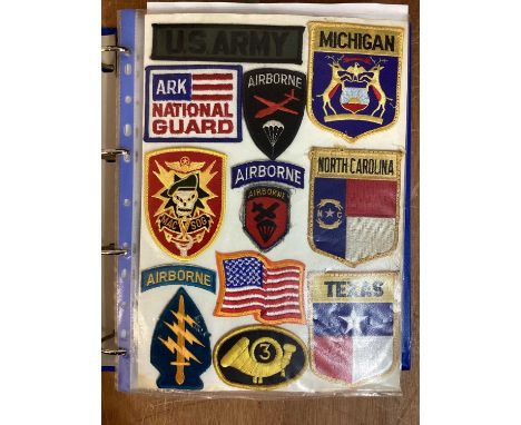 Four albums of American Air Force, US Navy and US Army cloth and metal badges including rank insignia (4 albums)