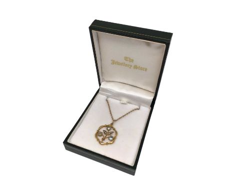 Edwardian 9ct gold seed pearl and gem set open work floral pendant on 15ct gold chain with barrel clasp, 44cm long  9ct gold 