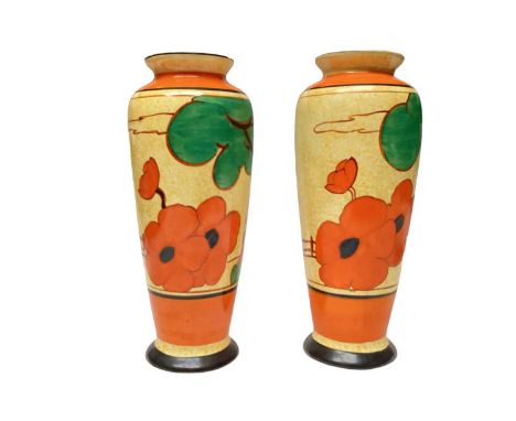 Two Clarice Cliff Bizarre range Cafe-Au-Lait vases with hand painted decoration, 22cm high and 21.5cm highThe larger vase app