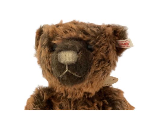 Three Steiff bears Woody 035777 with tags, certificate and box. Also Beige Teddy 664120 and Black Classic bear 039942 both in