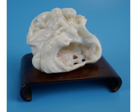 Carved white opal figure depicting lady &amp; lion