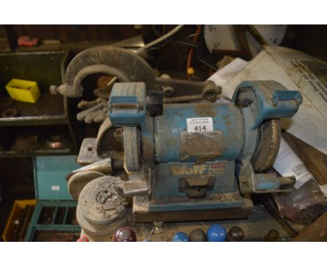 A Wolf bench grinder.