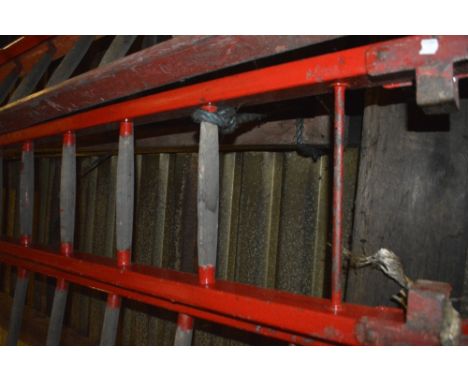 An iconic red painted wooden steeplejack ladder, with metal rung strengtheners and 21 rungs (strictly for decorative purposes
