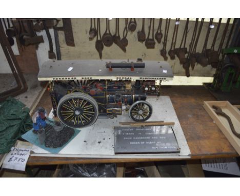 A miniature steam engine, 'two years in construction from cardboard and pieces of scrap, by Ron Thompson', length approx. 23 