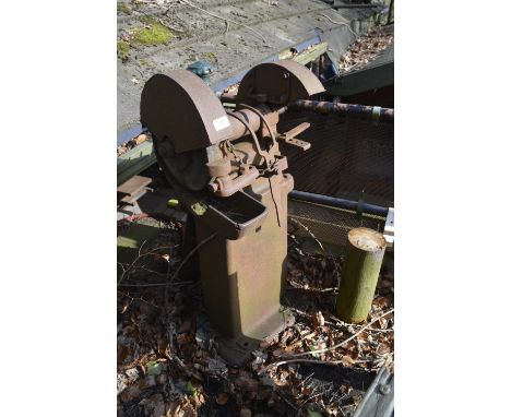 A twin-wheel grinder, height approx. 44".