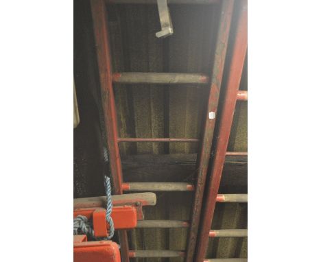 An iconic red painted wooden steeplejack ladder, with metal rung strengtheners and 21 rungs (strictly for decorative purposes
