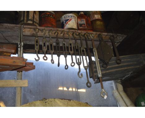Ten variously sized wire tighteners, a pulley and a ring spanner (12),