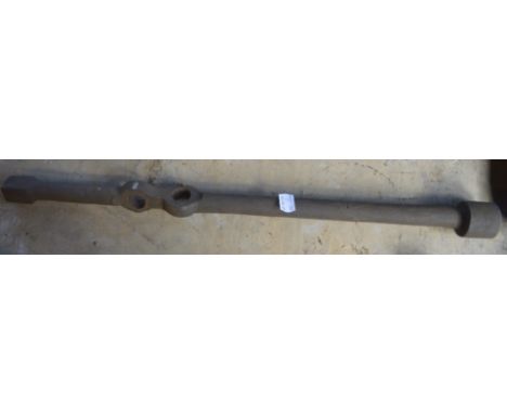 A ring spanner with two apertures for leverage, length approx. 22". 