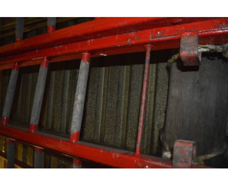 An iconic red painted wooden steeplejack ladder, with metal rung strengtheners and 21 rungs (strictly for decorative purposes