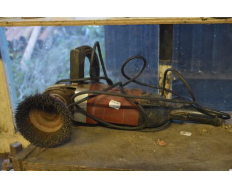 A Clarke angle grinder with wire brush head.