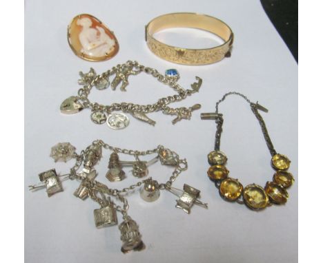 A gold-plated bangle, silver bracelets and cameo brooch