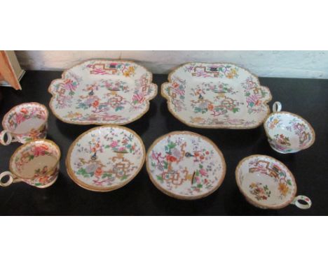 A pair of Chinese tree design plates, four saucers and two pairs of cups (one saucer hairline crack)