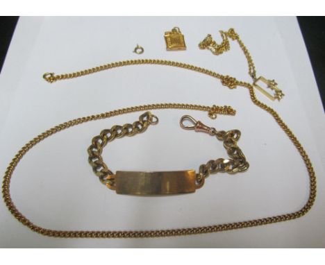 A gold coloured identity bracelet, long chain, pendant on chain and a lighter charm