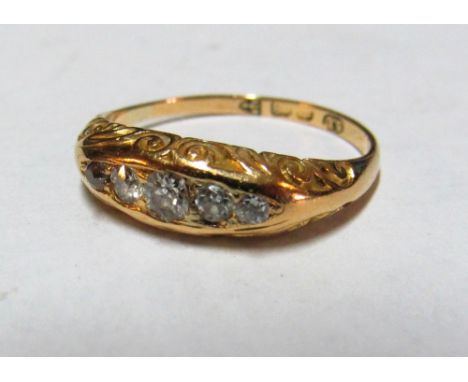 An 18ct gold five stone diamond ring, size M 3.3g