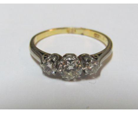 An 18ct three stone diamond ring, size M 2.2g