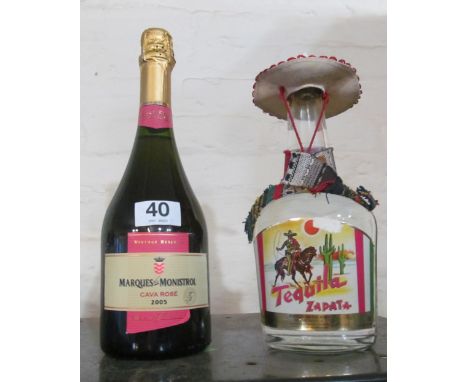 A bottle of Tequila and a bottle of 2005 Cava Rose