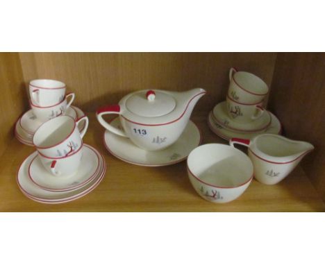 A Crown Devon teaset:- teapot, bread and butter plate, six plates, six saucers, six cups, sucrier and milk jug stag design