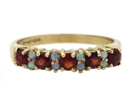 9ct gold garnet and opal half eternity ring, hallmarked Condition Report & Further Details Approx 2.4gm, size P-QClick here f