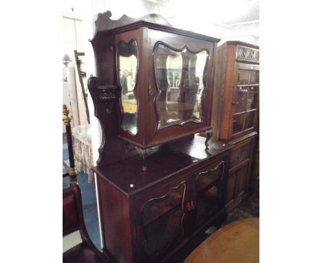 A Late Victorian Mahogany Parlour Cabinet with glazed shelved Base over Stretcher Shelf, Raised glazed and Mirrored Top Displ