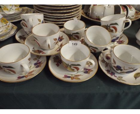 A Collection of Royal Worcester Evesham to Include Ten Cups and Seven Saucers. 
