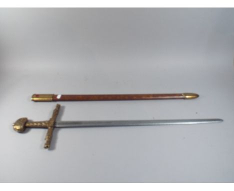 A Reproduction Brass Handled Sword in Jewelled Scabbard.