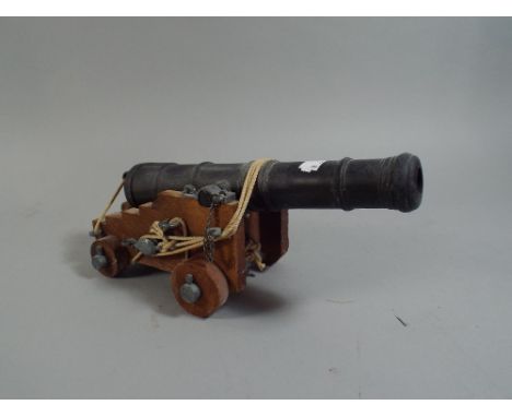 A Scale Model of A Naval Cannon.