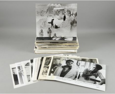 400+ vintage black & white film stills, mainly 10 x 8 inches including Gary Cooper, Ice Station Zebra, Superman, The Karate K